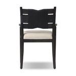 View of the Tova Dining Armchair from the back showing the rope wrapping over horizontal wooden slats