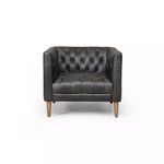 Front view of ebony leather chair highlighting tufted backrest and wooden legs
