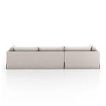 Back view of the sectional showing smooth fabric slipcover and straight lines