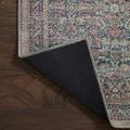 Folded back corner of Adrian Denim Multi Rug revealing solid black underside lining and multi color pattern edge