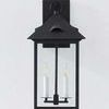 Corning Exterior Wall Sconce front view mounted on wall with candles lit inside