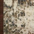 Corner of rug laying on dark wood floor highlighting intricate pattern detail