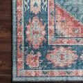 Close-up of Skye rug corner showing detailed floral border and textured polyester surface