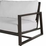 Close-up of left arm and cushions with visible black aluminum frame texture