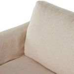 Close-up of front corner with seat cushion and armrest stitching detail in oatmeal fabric