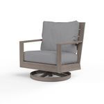 Laguna Swivel Club Rocker with driftwood-style aluminum frame and gray cushioned seat and backrest