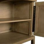 Close-up of interior corner with open door showing wood grain, shelf edges, and metal hinge detail