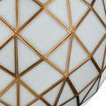 Close-up of Polyhedron Pendant showing detail of white glass with milky drifts and brass hardware