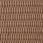 Back view showing the tapered wicker leg and woven barrel back of the dining chair