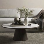 Skye table styled with ceramic vases, books, and greenery in a living room setting