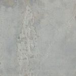 Close-up of rough, textured gray area with detailed uneven surface and mixed media effect