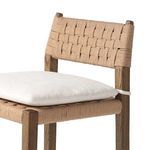 Detailed close-up of the woven paper cord backrest and cushion fabric