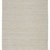 Handwoven Danan indoor/outdoor rug in solid heathered ivory and light gray with low-profile polyester weave