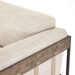 Close-up showing seat and back cushion with slight color variations in fabric