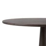 Side angle close-up of table edge with dark oak veneer surface and tapered base
