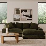 Styled sectional in a neutral living room setting with wooden coffee table and wall art