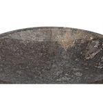 Macro shot of the polished dark marble surface revealing fine grain detail