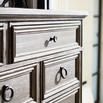 Close angle of top corner drawer of Canyon Ridge chest showing bead molding and distressed iron knob in natural light
