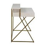 Side profile of Ember Desk showing cross-braced antique brass legs and elevated wooden shelf