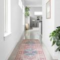 Skye Brick / Ocean Rug shown as narrow runner in bright hallway with white walls and concrete floor