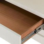 Open drawer of Florence 2-Drawer End Table showing wood interior and metal slide mechanism