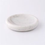 Large round white marble tray with smooth polished surface and subtle grey veining