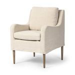 Aurelia Dining Chair Cover in natural linen fabric with sloping track arms and tapered wooden legs extending below a short...