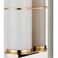 Close-up showing polished brass ring detail encircling milky glass tube and polished nickel backplate edge