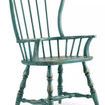 Sanctuary Spindle Arm Chair in Sky High Azure Blue viewed from front side angle showing curved armrests and seat
