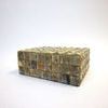 Open box lid resting on edge showing interior wood and bone cube detail on lid