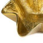 Close-up of Pedicoat bowl's textured gold surface and smooth ruffled edge detail