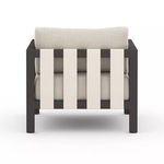Back view showing neutral wide horizontal straps on aluminum frame of Sonoma Faye Sand Outdoor Chair