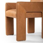 Detail showing thick square padded leather leg with clean stitching near seat support