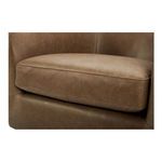 Close-up focus on thick cushioned seat fabric with detailed stitching