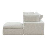 Profile view highlighting thick seat cushions and ottoman detail