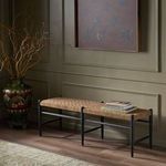 Wider view of Wyatt Bench in room setting with decorative objects on top and floor rug visible