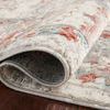 Rolled edge detail of Estelle Ivory Rust rug showing pile thickness and backing on dark wood floor