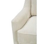 Detailed view of armrest and seat cushion edges with raised piping and vertical ribs
