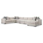 Drew 6-piece fabric sectional with neutral upholstery, fiber back pillows, accent pillows, and chunky wooden legs