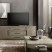 Console in living room setting beneath flat screen TV with armchair, floor lamp, and coffee table nearby