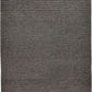 Charcoal gray rug with geometric triangular patterns and fringed edges, woven texture