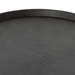 Rounded hammered iron top featuring subtle ridges and textural finish