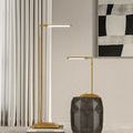 Contemporary room with two Autrand Desk Lamps, one on geometric side table, other on stack of books