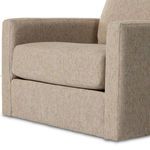 Close-up of chair seat cushion and armrest showcasing tightly woven beige fabric texture