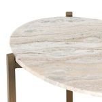 Close-up focusing on marble texture and brass frame overlap at corner of nightstand