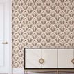 Wallpaper applied on a full wall in a room with white door and a modern sideboard with diamond handles