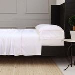 Sheena Bamboo Sateen Sheet Set in soft pink on California King bed with smooth drape and subtle sheen