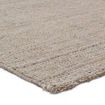 Detailed close-up highlighting the fiber blend and looped, textured weave in soft neutral shades