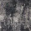 Flat lay overhead view highlighting full abstract charcoal and silver pattern on rug