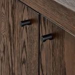 Close-up showing grain and finish texture on top surface of sideboard